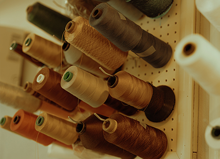 threads in varying shades of brown and tan